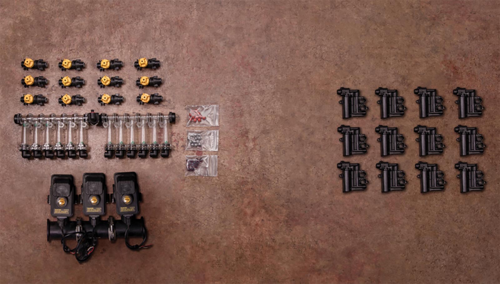 various components of the Precision Planting V Apply H D system laid out on a flat surface