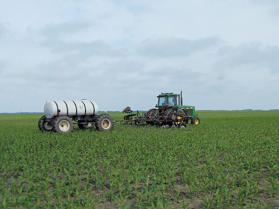 Yetter All Steer Cart being pulled behind a liquid fertilizer applicator