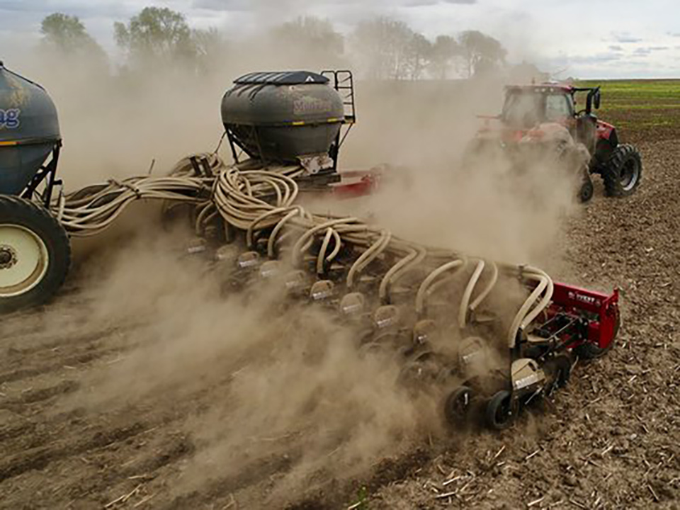 Harvest International UltraMax Striptill toolbar in use in a field