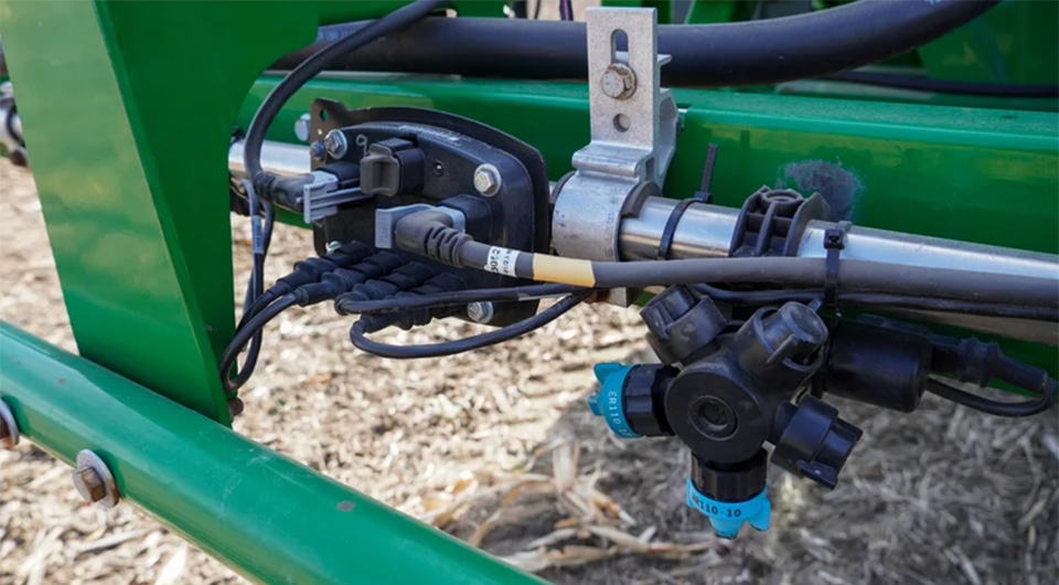 Precision Planting Symphony Nozzle mounted on a sprayer